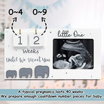 Jwitao sonography picture frame styled as nursery decor on a wooden shelf.
