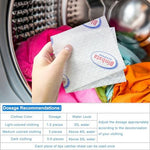 Lifestyle view of mixed colored laundry being loaded with a dye catcher sheet.