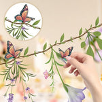 Ghegicu enchanted garden theme floral banner suspended from an indoor ceiling for a birthday celebration setting.