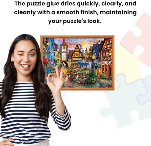 Wide plastic spreader tool applying clear glossy liquid evenly across a colorful one thousand piece tabletop jigsaw.