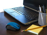 Logitech M317 portable laptop mouse showing soft rubber side grips and scroll wheel
