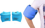 Children and adults wearing blue swimming arm floaties