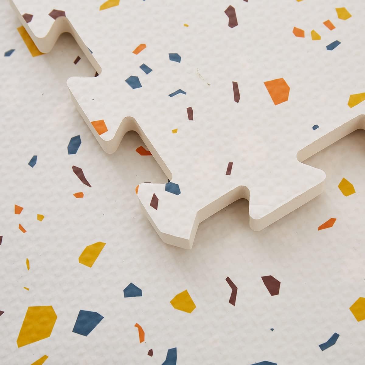 Generic terrazzo puzzle playmat front view on floor