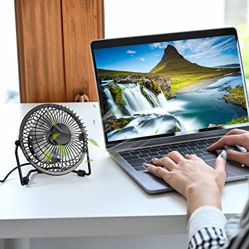 Side angle view of the four inch portable cooling fan illustrating the three hundred sixty degree vertical rotation capability.