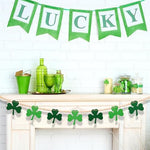 Close up view of the green felt shamrocks and natural wooden beads on the farmhouse clover banner.