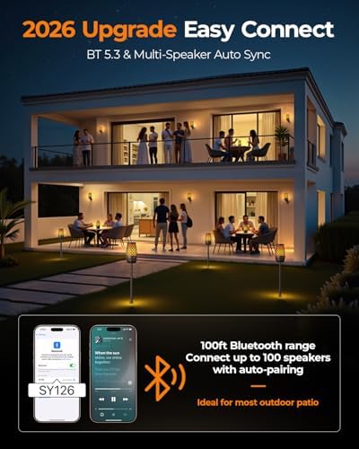 Hesontec portable speaker mounted on a ground stake in a backyard setup with warm ambient lighting.