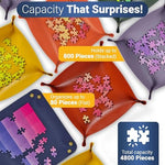Six multi colored Kraftex sorting boxes spread out to demonstrate efficient color separation for adult puzzles.