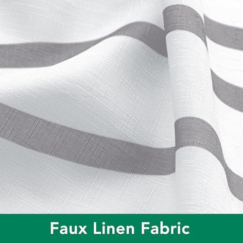 The silver grey dancing lines pattern on the white background of the Biscaynebay fabric bathroom curtain.