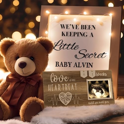 Expecting parents holding the EURSET illuminated sonogram frame during a pregnancy announcement celebration.