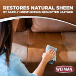 Weiman leather wipes cleaning a leather sofa in a living room