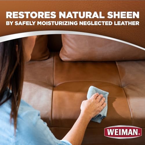 Weiman leather wipes cleaning a leather sofa in a living room
