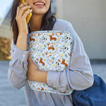 Dadanism blue dog tablet sleeve holding an iPad