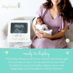 Close up of the metallic text detailing on the Tiny Ideas love at first sight baby milestone frame.