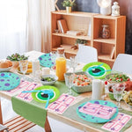 Close up of monster party plates and plastic forks