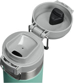 Stanley 24 Ounce stainless steel insulated flask with push button lid open.