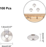 Close up of smooth polished flat round metal spacer beads for DIY jewelry