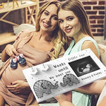 Interchangeable wooden number plaques tracking remaining weeks on the sonography photo frame.