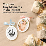 Two sides personalized baby keepsake ornament hanging beautifully on a decorated holiday tree branch.