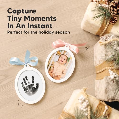 Two sides personalized baby keepsake ornament hanging beautifully on a decorated holiday tree branch.