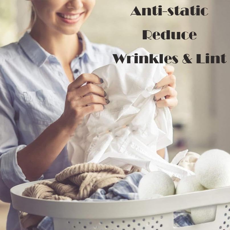 Anti static laundry dryer balls being placed into a washing machine dryer drum for clothing separation.