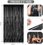 Black shimmer tinsel backdrop curtains hanging over a party doorway