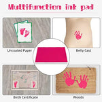 Water soluble pink stamp pad next to a finished baby footprint milestone card