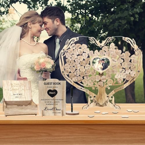 Heart shaped photo frame on wooden wedding guest book