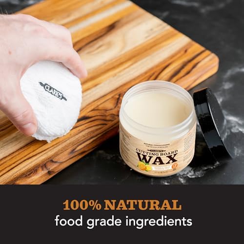 Hand applying Clark's wood conditioner to a cutting board