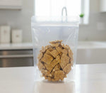 SweetGlob traditional homemade style golden peanut brittle pieces displaying roasted peanuts and caramelized sugar texture.
