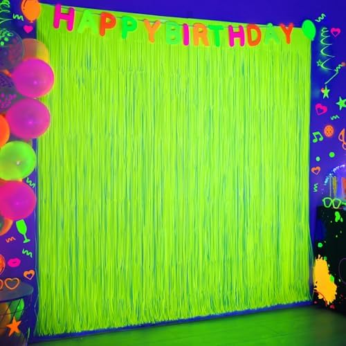 Mega-Loopolis neon party decorations glowing vibrantly under a blacklight setup for a birthday celebration