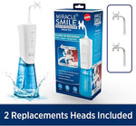 White cordless water flosser with replacement heads and charging cable