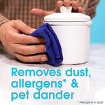 Imported Pledge multisurface spray being used on a sealed wooden table
