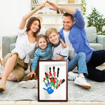 Handprint for family members arranged beautifully inside a traditional brown border frame