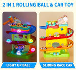 Three mini racing cars launching down the multi-level colorful ramp track system.