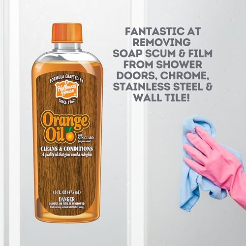 Holloway House cleaner removing soap scum from shower door