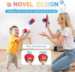 Toddler playing with Dishio catch ball toy in garden