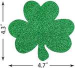 Pre-assembled foil shamrock string decorations creating a dramatic party entrance in a doorway backdrop.