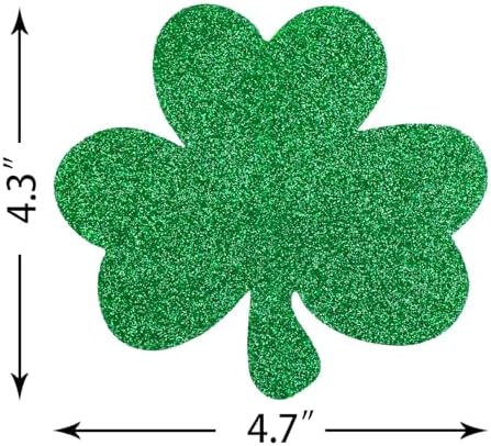 Pre-assembled foil shamrock string decorations creating a dramatic party entrance in a doorway backdrop.