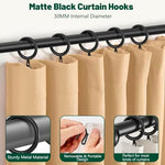Dpyrrhic black curtain hooks installed on a modern pinch pleat window drape showing the elegant hanging style.
