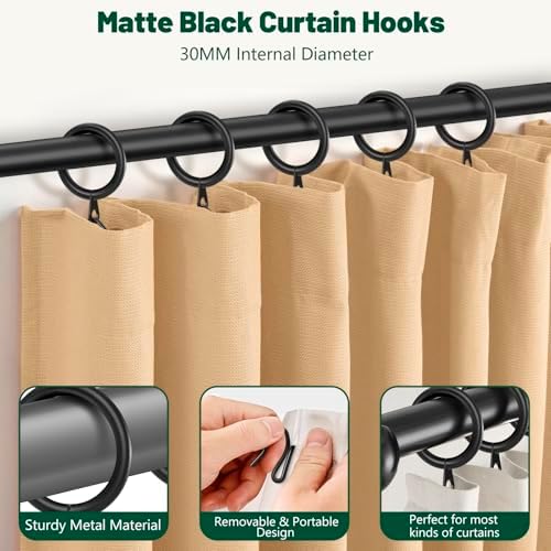 Dpyrrhic black curtain hooks installed on a modern pinch pleat window drape showing the elegant hanging style.