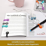 SUNFICON Magnetic Earphone Keeper being used as a colorful bookmark on an open book page