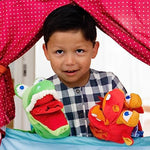 Close up view of the moving googly eyes on the HABA dragon hand puppet for sensory play.
