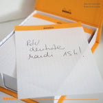 Rhodia memo pad back view displaying non-skid cardboard backing structure