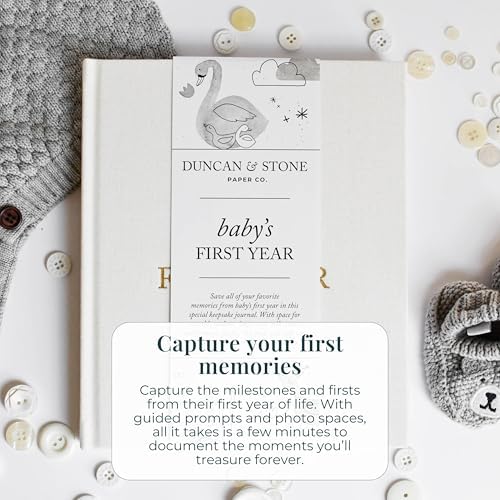 Open pages of the Duncan And Stone keepsake journal displaying milestone prompts and photo spaces