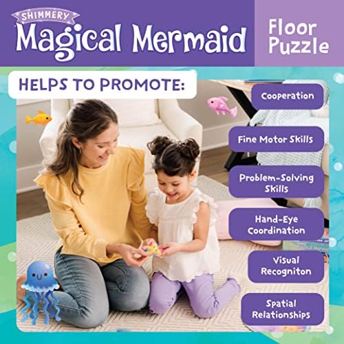 Top down shot of the large pieces of the Peaceable Kingdom magical mermaid game spread out on a play mat.