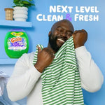 Gain laundry pods displayed next to freshly washed clothes to highlight fabric care and scent freshness.