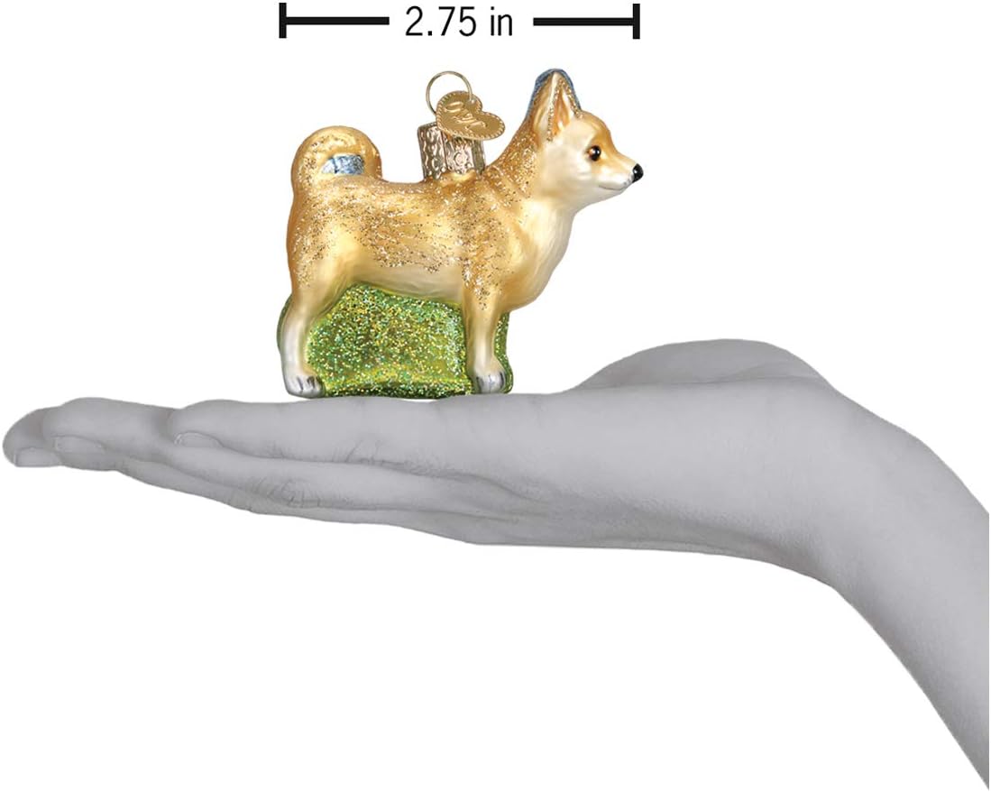 Close-up of the hand-painted face and upright ears on the Chihuahua Christmas tree ornament.