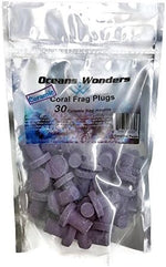 Close up view of purple ceramic aquarium frag plugs for reef tanks