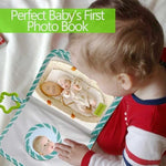 GPIRAL dinosaur theme infant photo album being held by parent to show lightweight scale.