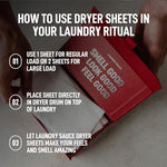 Single luxury scented laundry dryer sheet being placed inside a dryer drum on top of garments